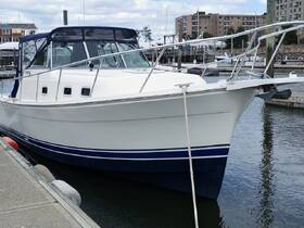 A well-maintained boat docked at the marina, showcasing its sleek design and features — perfect for fishing trips or leisurely cruises.