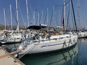A beautiful sailboat named 'Diana' docked in a marina, surrounded by other vessels under a clear blue sky — perfect for sailing adventures.