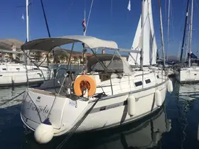 A beautiful Bavaria Cruiser 32 yacht named 'Danjela' docked in a serene marina, showcasing its sleek design and inviting atmosphere.