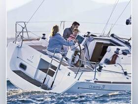 A family enjoys a sailing experience aboard an Oceanis 31, capturing the joy of being on the water together.
