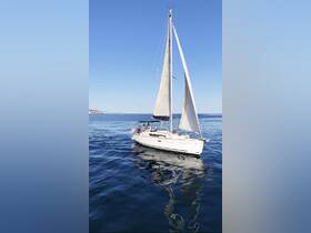 A group enjoys a sailing adventure on a calm ocean, showcasing the beauty of the sea and the joy of being on a boat.
