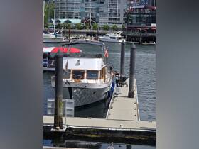 A family enjoys a day at the dock with a beautiful boat in view, showcasing the vibrant marina atmosphere.