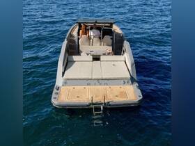 A stylish yacht viewed from the back, featuring comfortable seating and a sleek design, perfect for a day on the water.