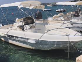 A sleek speedboat docked in clear waters, showcasing its modern design and inviting atmosphere for a day on the water.