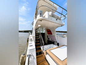 A detailed view of the interior of a yacht, showcasing the helm area and seating arrangements, perfect for comfortable cruising and relaxation.