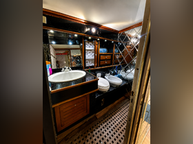 A well-appointed boat bathroom featuring modern fixtures, including a sink and toilet, designed for comfort and convenience while at sea.