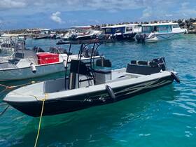 A sleek speedboat docked in clear turquoise waters, showcasing its modern design and perfect for thrilling water adventures.
