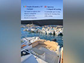 The spacious L-shaped aft seating area provides a comfortable space to relax and enjoy stunning views while cruising, perfect for leisurely outings on the water.