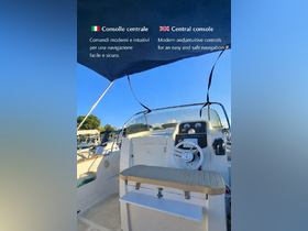 A detailed view of the central console and helm area of a boat, showcasing modern controls for safe navigation.