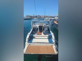 A clear view of the interior of a boat showcasing the helm and seating area, perfect for relaxing and navigating on the water.