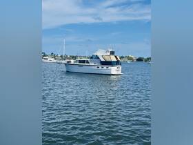A beautiful yacht docked in calm waters, showcasing its elegant design against a clear blue sky — perfect for luxury boating experiences.
