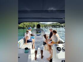 A lively group enjoys their time aboard a boat, creating memorable moments in a scenic setting — perfect for social gatherings and adventures on the water.