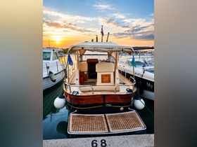 A beautifully docked boat at sunset, showcasing its elegant design and serene surroundings — perfect for a relaxing day on the water.