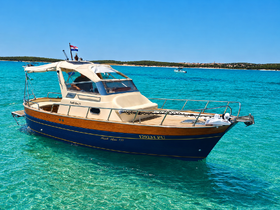 A beautiful boat cruising through crystal-clear waters, showcasing its elegant design and perfect for summer adventures.