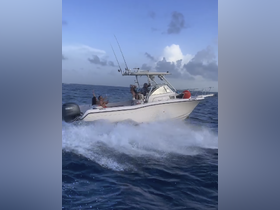 A lively group enjoys a fun day on the water aboard a fishing boat, celebrating with laughter and excitement as they cruise through the waves.