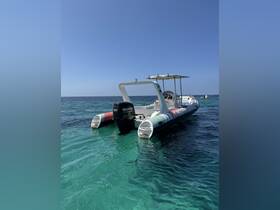 A sleek speedboat glides through crystal-clear waters, showcasing its vibrant design and perfect for thrilling adventures on the sea.