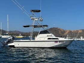 A sleek fishing yacht named 'Costa Del Sol' docked in calm waters, showcasing its robust design and fishing gear — perfect for sport fishing adventures.