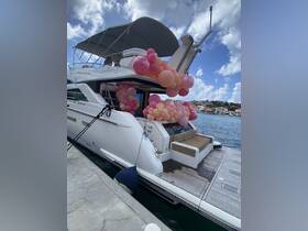 A beautifully decorated yacht adorned with balloons, docked at the marina, perfect for celebrations and events on the water.