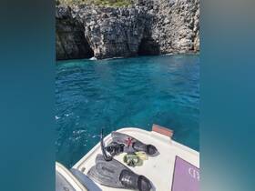 Snorkeling gear laid out on the edge of a boat, with a stunning rocky coastline in the background, perfect for underwater exploration in crystal-clear waters.