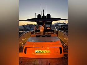 A stylish interior view of a MODULNOVA TT420 yacht, showcasing elegant seating and a modern helm, perfect for luxurious outings at sunset.