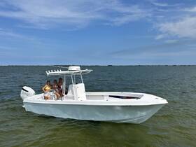 A group of friends enjoys a sunny day on the water aboard a sleek boat, perfect for summer adventures and outdoor fun.