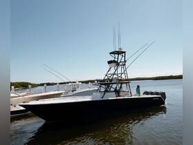 A sleek fishing boat is docked at the marina, showcasing its impressive design and fishing gear, perfect for a day out on the water.