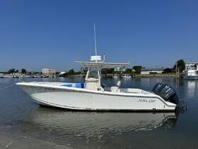 A pristine McKee Craft speedboat docked in calm waters, showcasing its sleek design and perfect for fishing or leisure outings.
