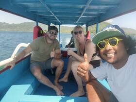 A cheerful group enjoys their time aboard a boat, giving thumbs up as they embark on an exciting adventure — perfect for creating unforgettable memories on the water.