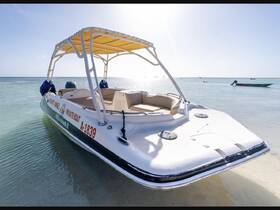A pristine private boat anchored in clear waters, perfect for a day of relaxation and exploration on the sea.