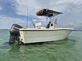 A sleek speedboat glides through clear waters, showcasing its design and features — perfect for a day of adventure on the water.