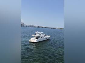 A stunning yacht glides through calm waters, showcasing its elegant design against a clear blue sky — perfect for luxury outings and charters.