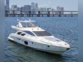 A stunning yacht docked in the water with a city skyline in the background, perfect for luxury charters and scenic views.