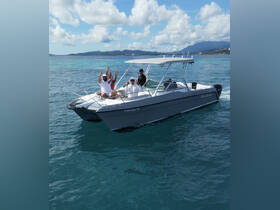 A lively group waves from their boat, enjoying a fun day on the water — perfect for creating unforgettable memories with friends.