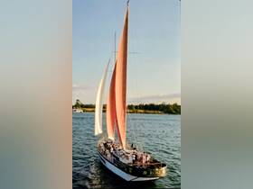A vibrant sailing experience with a group aboard a beautifully rigged boat, showcasing the joy of being on the water.
