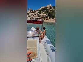 Two friends enjoy a sunny day on a boat, surrounded by stunning rocky landscapes and clear waters — perfect for a beach getaway.