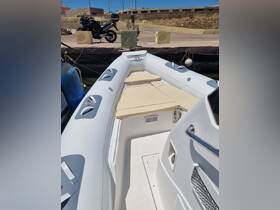 Interior view of a sleek boat featuring comfortable seating and a well-designed helm area, perfect for a day on the water.