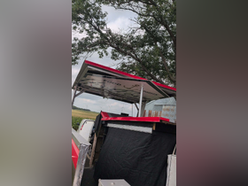 An unclear image of a boat structure with a food service area, possibly indicating a unique dining experience on the water.