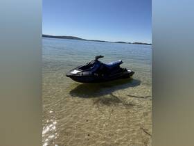 A sleek jet ski parked in shallow waters, perfect for a day of fun and adventure on the lake.