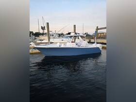 A sleek center console boat docked at the marina, showcasing its stylish design and readiness for a day on the water.