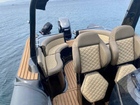 A stylish interior view of a boat's helm and seating area, showcasing luxurious design and comfortable seating, perfect for a day on the water.