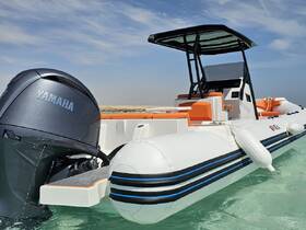 A sleek Yamaha speedboat anchored in clear waters, showcasing its modern design and vibrant seating — perfect for thrilling water adventures.
