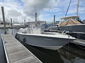 A sleek speedboat docked at the marina, showcasing its modern design and readiness for adventure on the water.