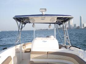 Interior view of a boat's helm and seating area, showcasing a modern design perfect for comfortable cruising.