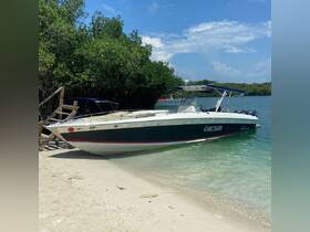 A sleek speedboat named 'Orchid' is docked on a sandy shore, surrounded by lush greenery and clear waters, perfect for a day of adventure on the water.