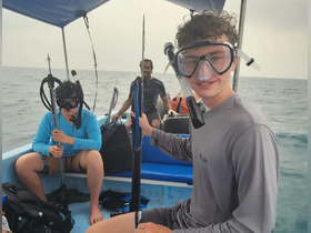 A group prepares for an exciting snorkeling adventure on a boat, showcasing the thrill of ocean exploration and marine life encounters.