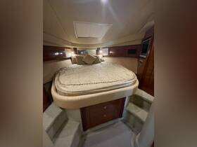 Cozy cabin interior featuring a comfortable bed and elegant decor, perfect for relaxing on overnight boating trips.