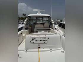 Interior view of the 'Ohana' boat showcasing comfortable seating and a well-equipped helm, perfect for relaxing on the water.