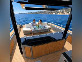 A couple enjoys a romantic dining experience on a yacht, complete with cocktails and stunning ocean views — perfect for special occasions or sunset cruises.