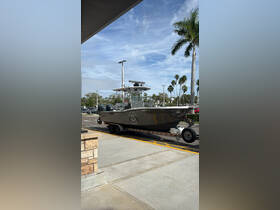 A sleek fishing boat on a trailer, ready for adventure. Perfect for anglers looking to explore the waters.