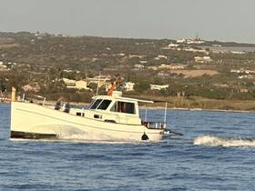 A classic boat navigates through calm waters, showcasing its elegant design and smooth movement, perfect for leisurely outings.